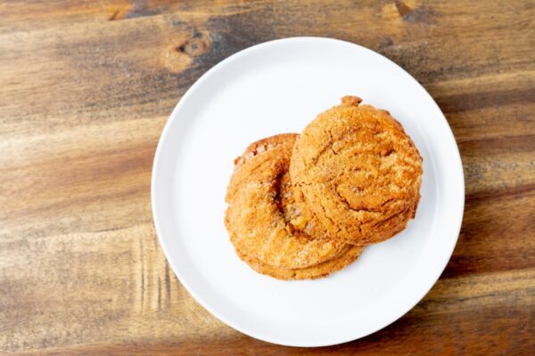 Two Snickerdoodle cookies on a plate. These cookies are available at Simply Baked Catering in Winchester, Ontario.