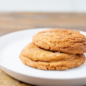 Two Snickerdoodle cookies on a plate. These cookies are available at Simply Baked Catering in Winchester, Ontario.