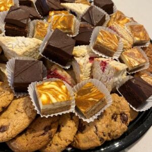 Image of a dessert party platter including a selection of dessert bars and brownies as well as chocolate chip cookies. Served at a small catered event by Simply Baked Catering Inc., Winchester, Ontario