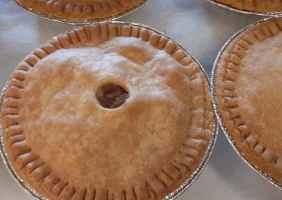 Fresh-baked 9-inch apple pie in a foil pie plate. Baked by Simply Baked Catering Inc. and available in a wide variety of flavours, delivered by our catering service.