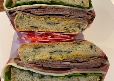 Roast beef sandwiches on freshly baked olive bread, individually wrapped and perfect for your next conference or event. Lunch catering services available in the Ottawa area.